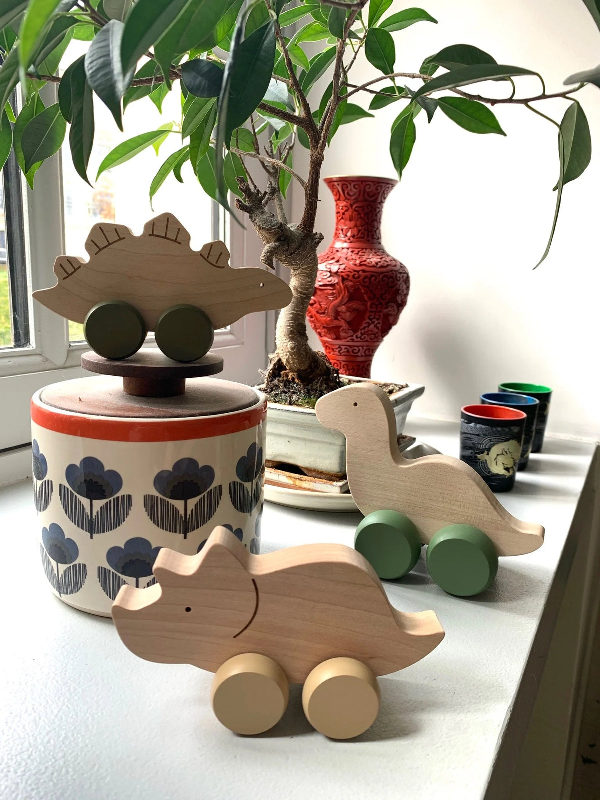 Wooden Stegosaurus Rolling Toy by Briki Vroom Vroom - Maude Kids Decor